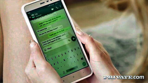 Woman's hands hold phone showing WhatsApp sexting chat offering tits pics and fuck.