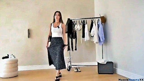 Asian model in white tank and black skirt trying on summer outfits