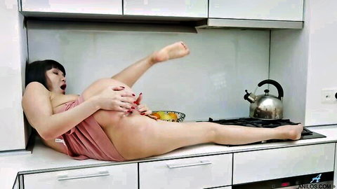 Mature Asian Black with long legs spreading wide in pink towel on counter