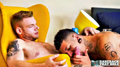 Tattooed Zachary receives oral from Roman Maverick in bareback gay scene