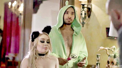 Skinny blonde with cat ears and small tits topless next to green Yoshi costume guy holding magnifying glass