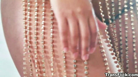 Summer Col hand on Eva Maxim's beaded trans body