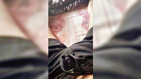 Solo amateur female masturbating in pink panties on bed