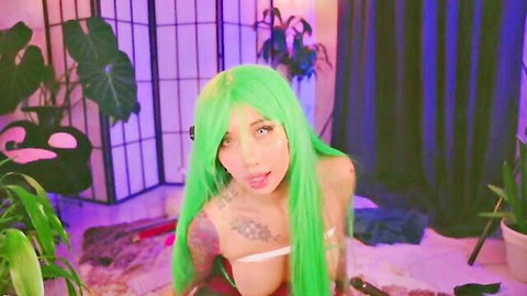 Tattooed green-haired babe with huge tits teasing seductively in white bra on webcam