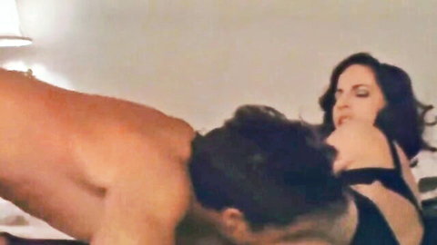 Muscular guy eats brunette babe's pussy in black lingerie on bed