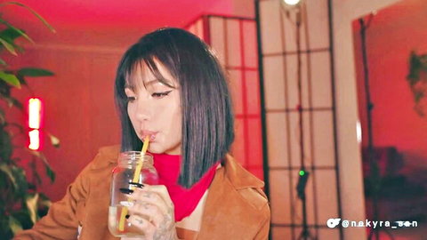 Mikasa Ackerman cosplay by nekyra_san sipping drink in sexy jacket and scarf