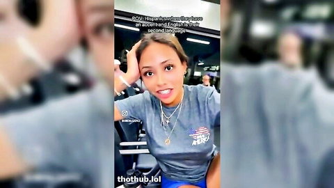 Smiling hot Latina in fitted gray t-shirt, playful tease pose