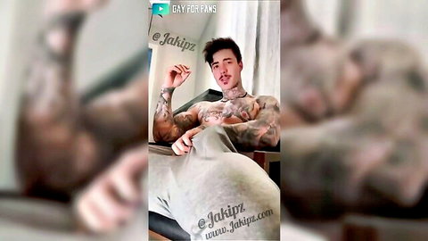 Tattooed muscle hunk Jake Andrich teasing bulge in gray sweatpants