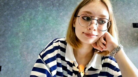 Elwinebanford teen in striped shirt and glasses, smiling casually
