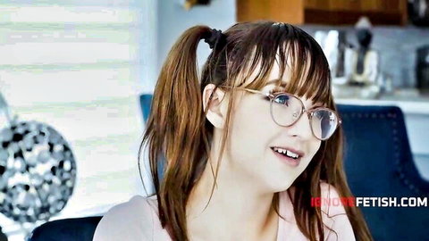 Cute brunette gal with glasses and pigtails smiling in pink top, sex junkie ready for use