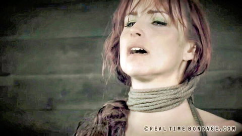 Redhead beauty bound in rope collar, intense BDSM punishment scene