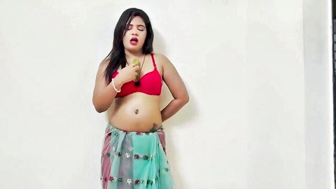 Sexy Indian babe with big tits in red bra moans seductively in low green saree skirt