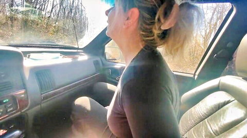 Blonde amateur in car forest scene, couple lovemaking preview