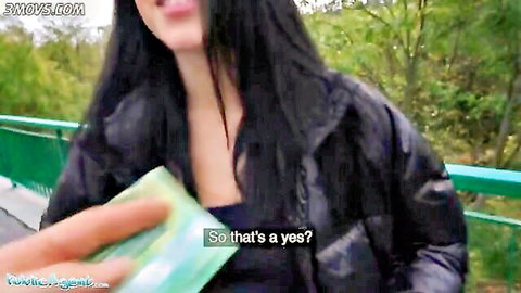 Alyssa Bounty smiling outdoors in black jacket, hitchhiking tease