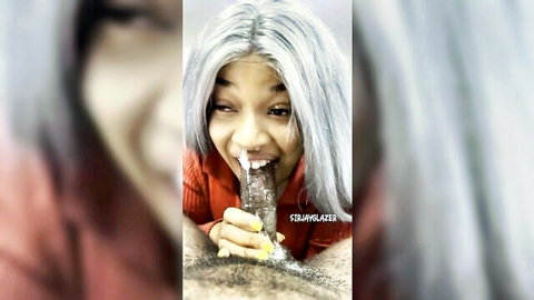 Silver-haired black woman giving blowjob with cum on face in red top