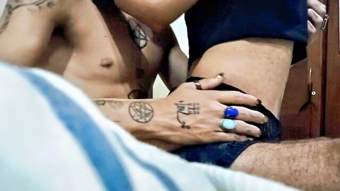 Tattooed man groping slim woman's bare waist intimately