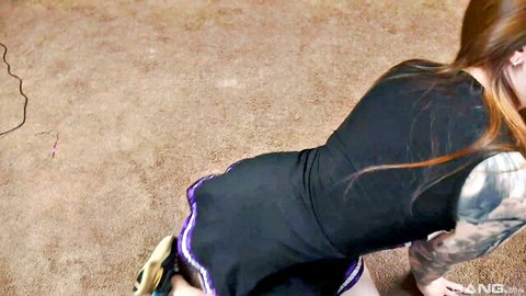 Redhead cheerleader Alison Bloom bends over in black skirt POV