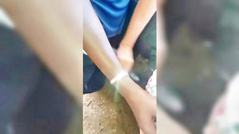 Amateur woman in dress gives handjob to black stranger