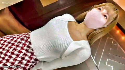 Seductive Asian woman in white top, checkered skirt, and pink mask showing cleavage