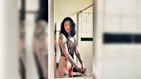 Molliganbitch tattooed brunette in mesh top, shaking legs orgasm solo