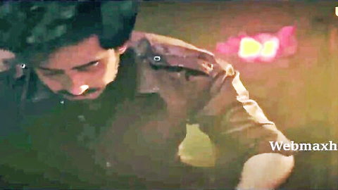 Handsome Indian man in brown jacket, intense gaze, Ullu web series teaser