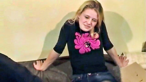 Blonde teen with bangs grimaces on couch during amateur old man blowjob