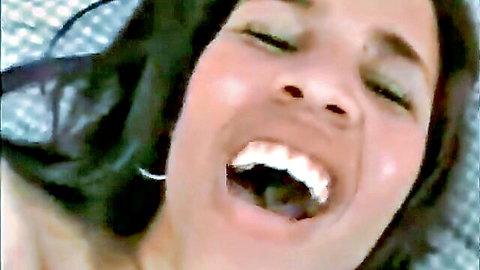 Nikki Fairchild close-up smiling with open mouth in adult video