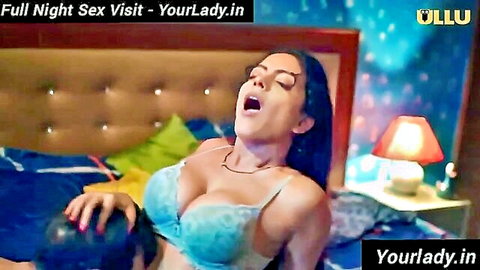 Curvy Indian woman in blue bra giving handjob on bed, moaning in ecstasy