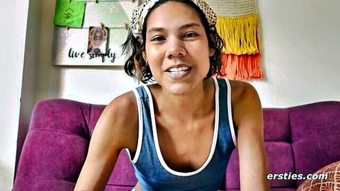 Smiling woman with curly hair and nice ass in blue tank top