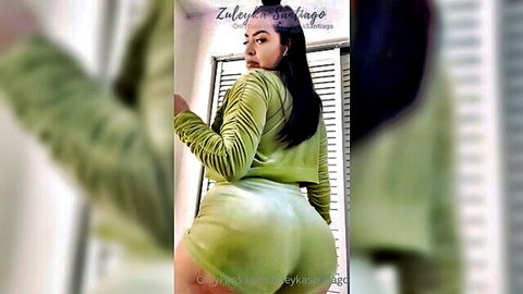 Zuley in tight green velour posing with big curvy ass