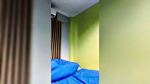 Blurry bedroom thumbnail of young Indonesian girl on blue bed, teasing for steamy fuck