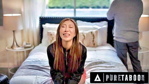 Nicole Doshi smiling excitedly in black jacket on bed, Pure Taboo scene