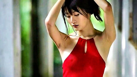 Mayu Mitsui in red keyhole top, arms raised seductive pose, JAV solo