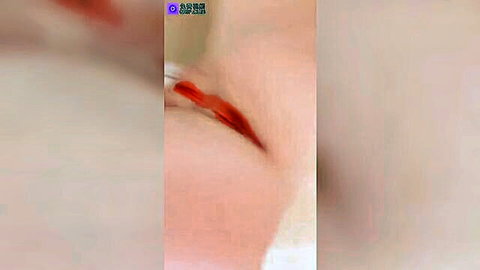 Blurry close-up of seductive red lips and pale skin in Stripchat webcam tease