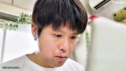 Young Japanese man with short black hair and earrings in white t-shirt