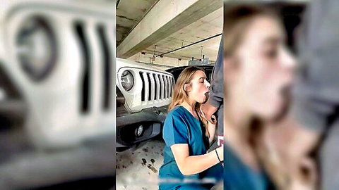 Blonde nurse in blue scrubs gives blowjob to man next to white Jeep in garage