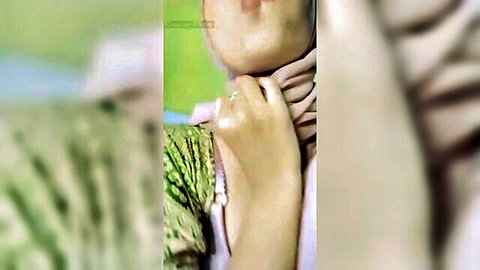 Hijab Arab woman purses plump lips in teasing blowjob face closeup