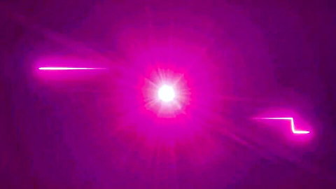 Abstract pink neon lights and glowing beams on purple background, evoking intense energy