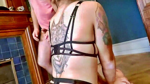 Ania Kinski in black harness lingerie with dragon back tattoo