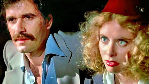 Vintage 1980s adult scene with Justine and mustached man in exotic red fez hat