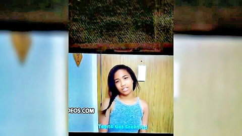 Young mixed-race stepsister in blue tank top smiling teasingly