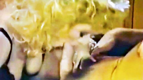 Nina Hartley blonde MILF in close-up fingering action