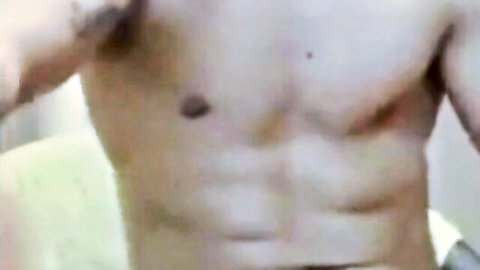 Muscular man showing off toned abs and chest in solo tease