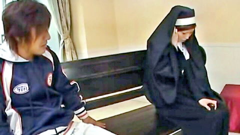 Petite Japanese nun babe in black habit sits beside young guy in hoodie on bench