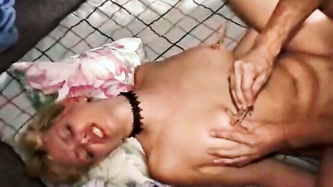 Blonde MILF in threesome with nipple clamps and hand groping breasts