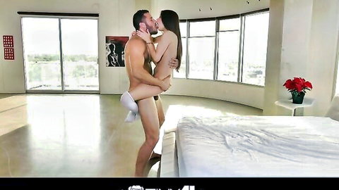 Nude couple in passionate standing lift kiss, girlfriend wrapped around boyfriend