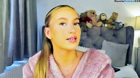 Blonde beauty in pink fluffy robe, smiling in cute clothes try-on