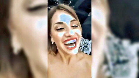 Italian camgirl with blue face mask smiling topless before blowjob