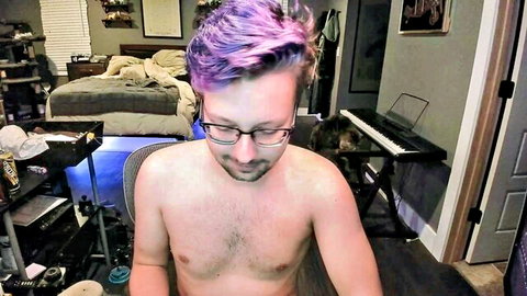 Shirtless purple-haired guy with glasses at webcam desk showing hairy chest
