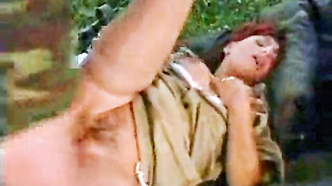 Redhead army nurse exposing herself in beige uniform, explicit scene from The Army Nurse